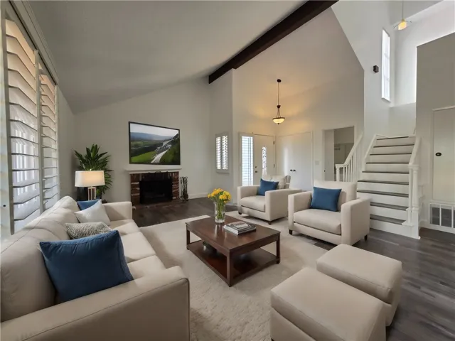 Enter into the large living room with vaulted ceilings.
