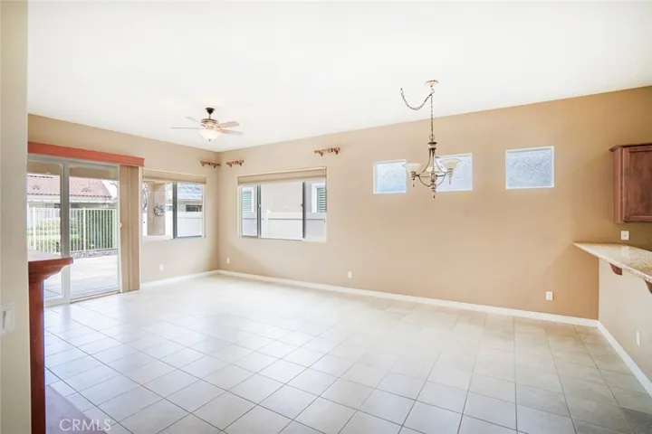 LIVING AND DINING AREA-TILE FLOORING.  OPENS FLOOR PLAN