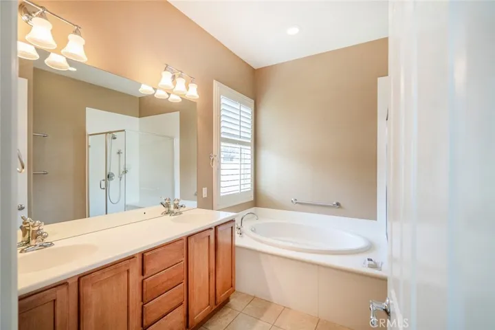 MASTER BATH-DUAL SINKS, CORIAN COUNTERS, SOAKING SUB