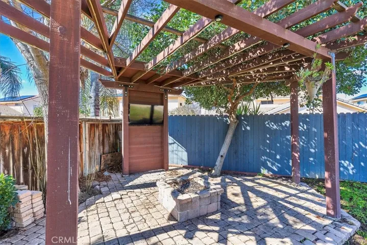Gazebo with TV and fire pit.