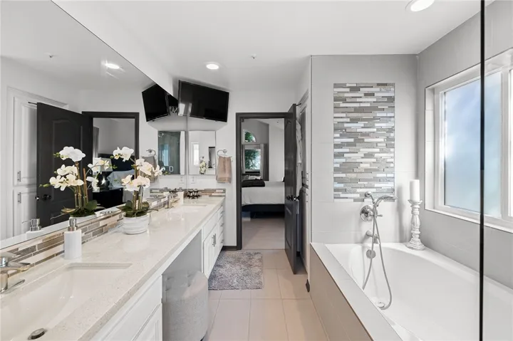 Primary bathroom with custom glass walk in shower