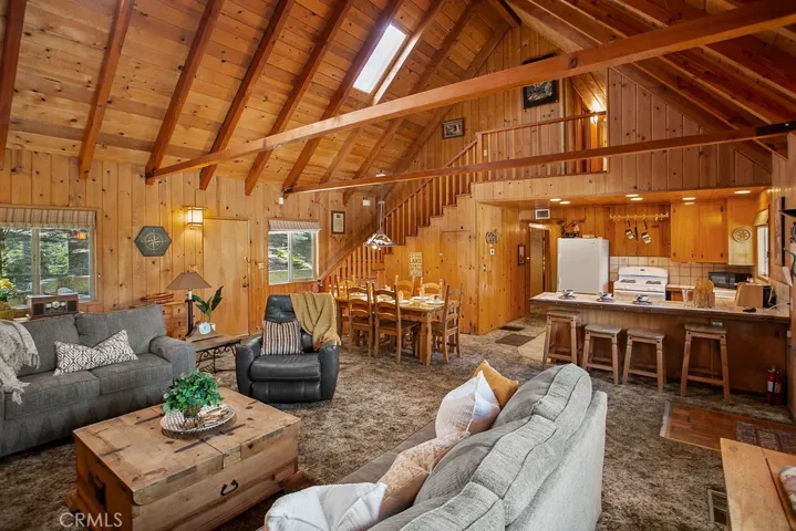 Gorgeous wood siding and rafters with skylight