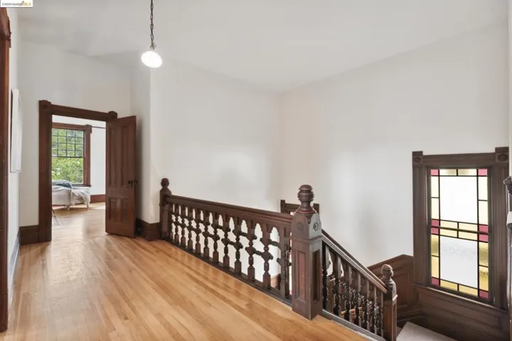 UPPER HALLWAY/BALCONY THAT OVERLOOKS THE ENTRANCE