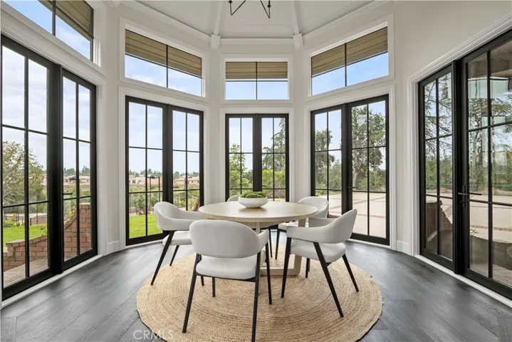 Sun room with breathtaking views of the tennis court, courtyard and mountains