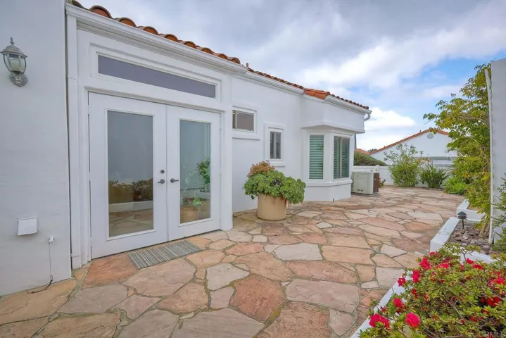 Side patio thru French doors off living room