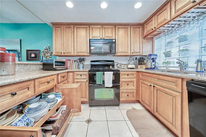 Pull out cabinet shelving makes this custom cabinetry unique and so useful.