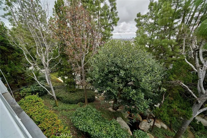 The lush canopy and manmade stream, outside the pool/spa area, adds tranquility and peace to your seaside condo.