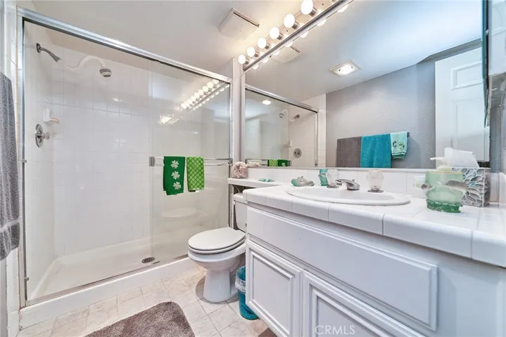 the hallway bathroom has a walk in shower if you need easy access ad a large vanity as well as custom tiling.