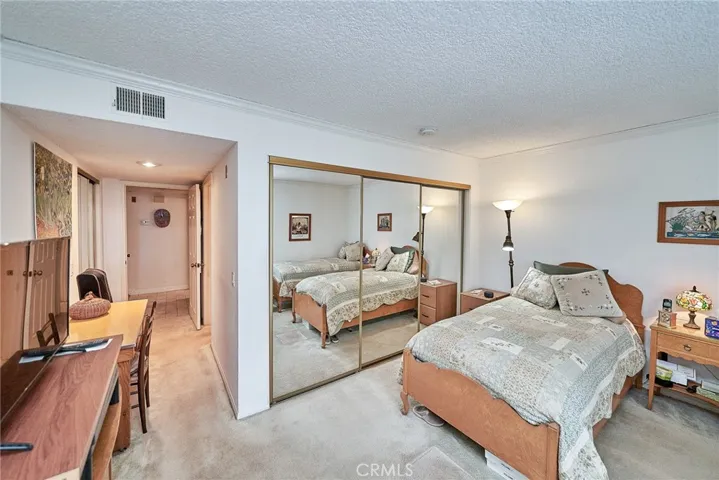 3 panel mirrored closet adds a nice touch and easy access to the large closet where you can store a dresser if you'd like to.