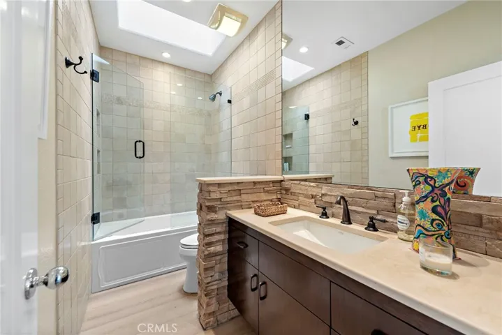 Guest Bathroom Accented with a Skylight