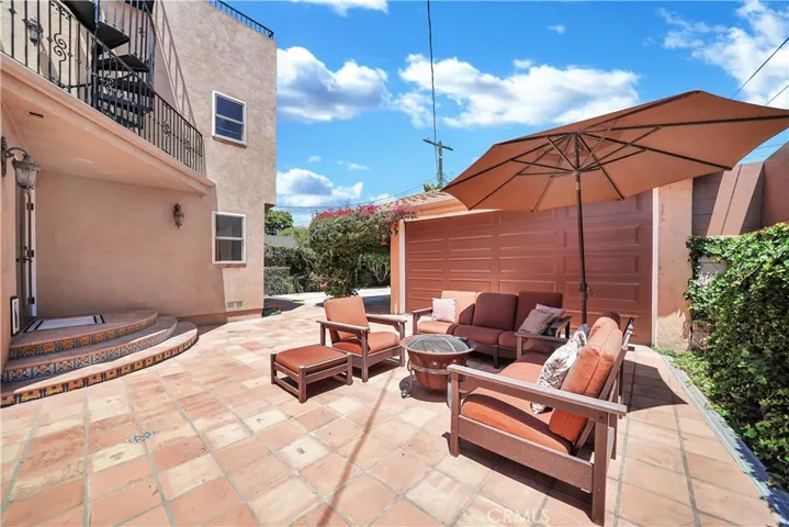 Patio behind driveway gate