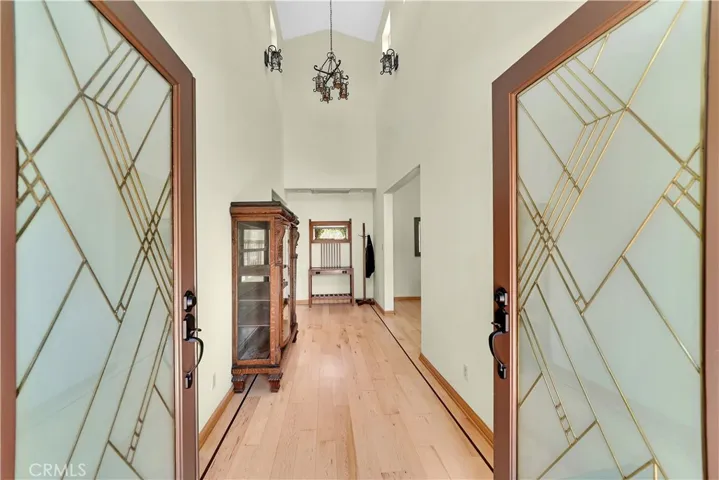 Double door entry to two-story foyer