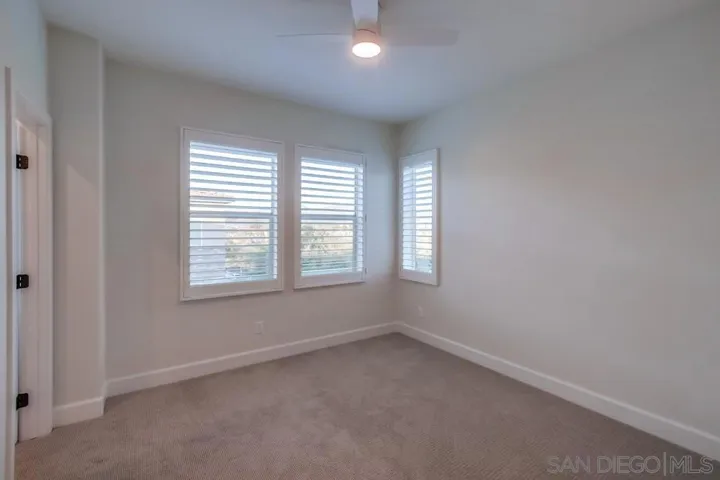 Bedroom with new flushmount, ultra quiet 6 speed ceiling fan with remote.