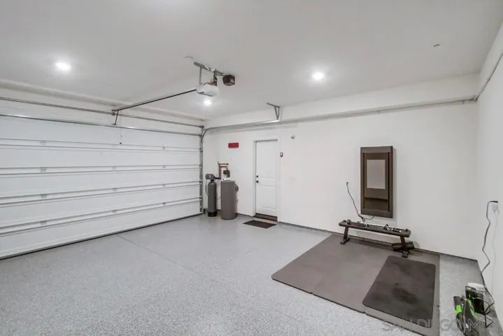 Tonal workout wall mounted system with workout bench and weights conveys! Water softener conveys.