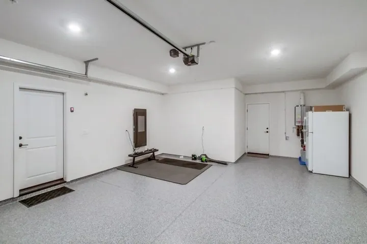 Oversized 2 car garage with epoxy flooring.