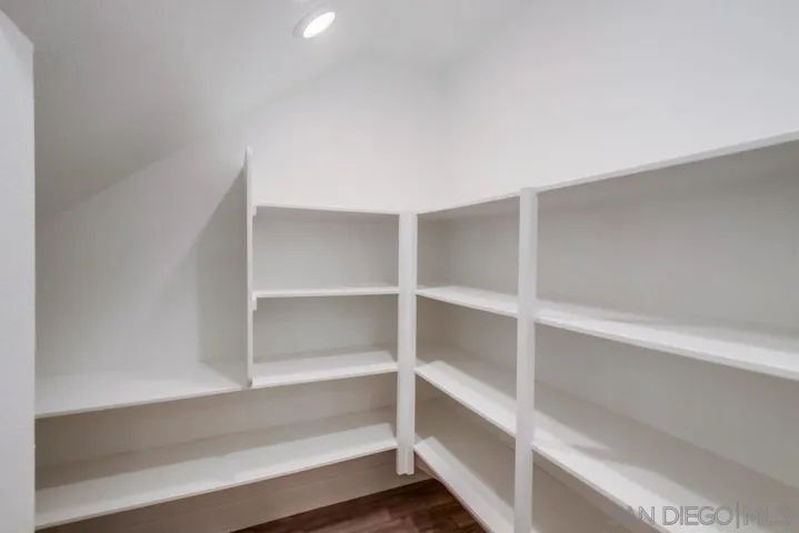 Large walk-in pantry that extends beyond the corner.