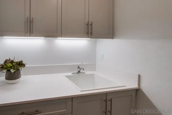 Upper and lower cabinetry with sink