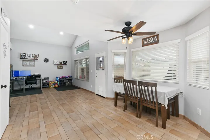 Large family room with eat in kitchen and view into the backyard.