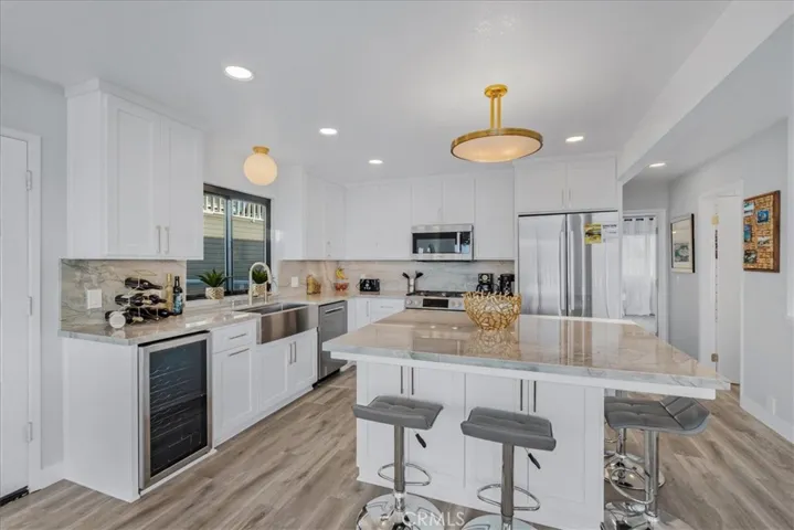 New kitchen cabinets, counters, appliances, fixtures and flooring.