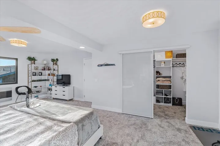 Primary suite with barn door closet.