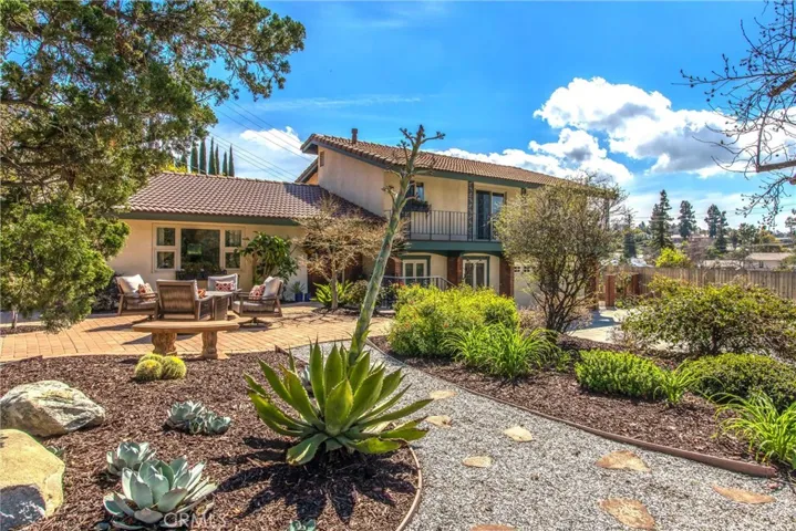 Beautifully landscaped with walking paths and seating areas through out front approach!