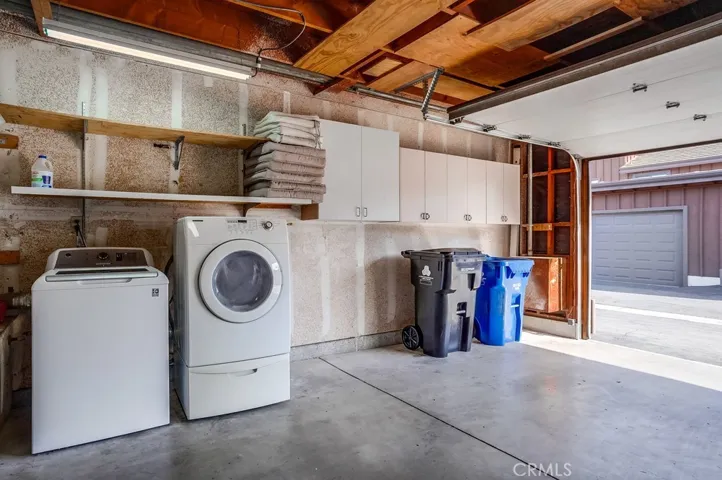 Laundry area and storage in garage