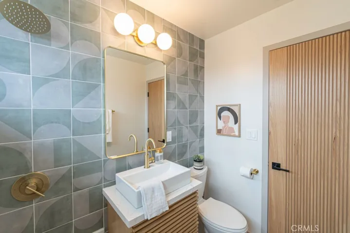 Tile accent wall and designer doors