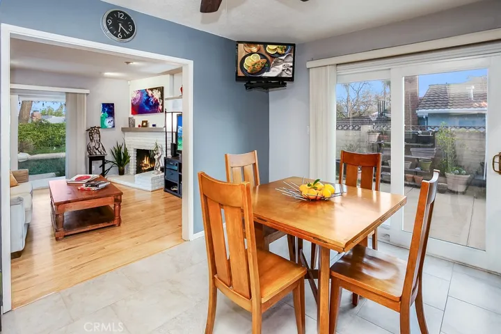 The dining room fittingly adjoins the kitchen and with its lighted ceiling fan, sliding glass doors leading to the backyard, and tiled floors, it is perfect for any occasion.
