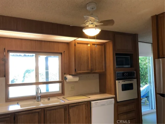 Kitchen window to pool, slider to far  right