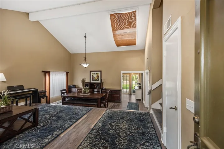 Large living room with open floor plan to the dining room.
