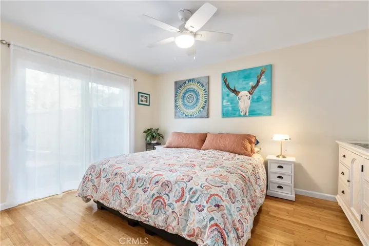 Primary bedroom with sliding door to backyard.