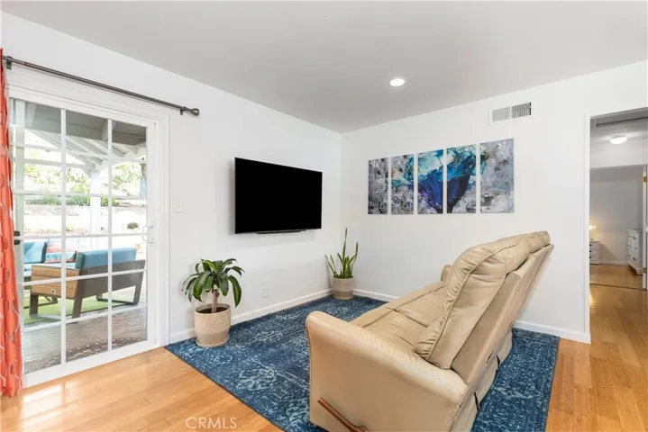 Living room with slider that leads to the backyard.