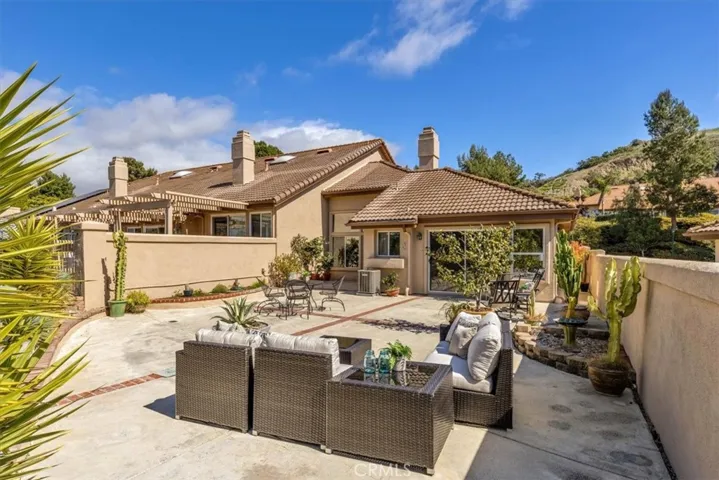 The back patio provides ample entertaining and dining options. Two sliders offer access from the living room as well as the master suite.