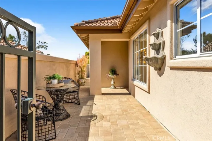 The moment you step through the private gated entry, you are enveloped with the warmth and charm of this single level residence.