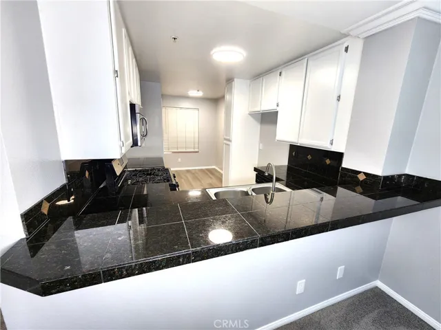 Back of Kitchen has an Extra Dining Area