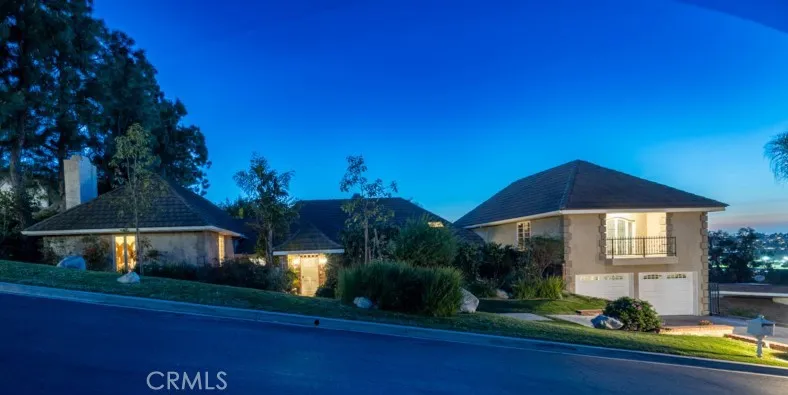 Front of home at street level at dusk