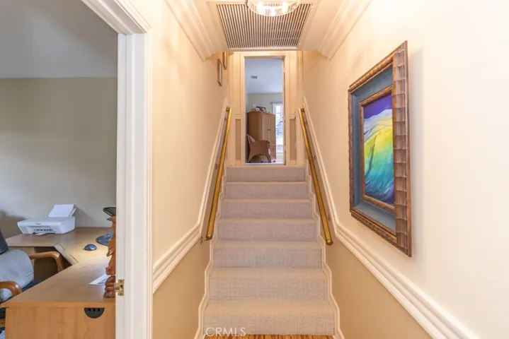 Small staircase up toward bedroom 3 and Primary bedroom