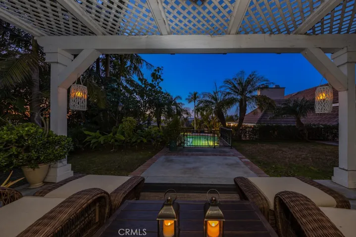 Gazebo looking out toward pool at night