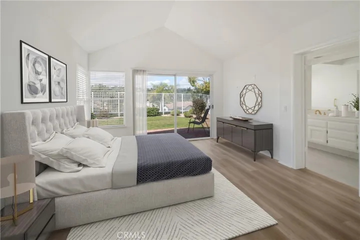 Primary Suite with vaulted ceilings-virtually staged