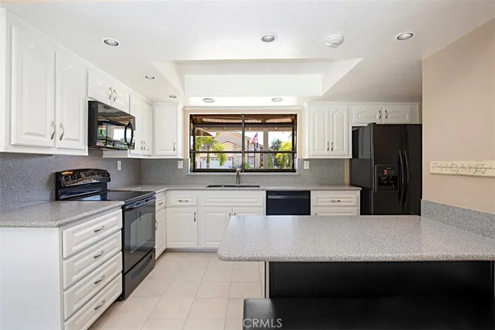 Kitchen Opens to Family and Dining Rooms