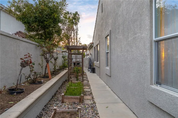 Side yard with gardens.