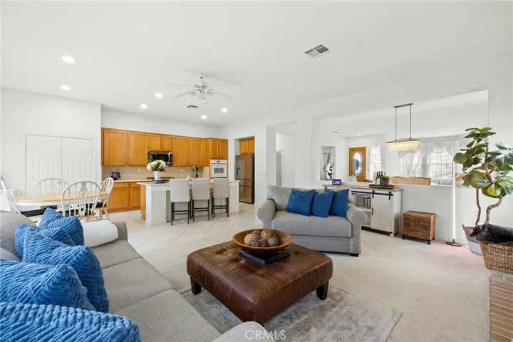 Family room with the open kitchen in the background.