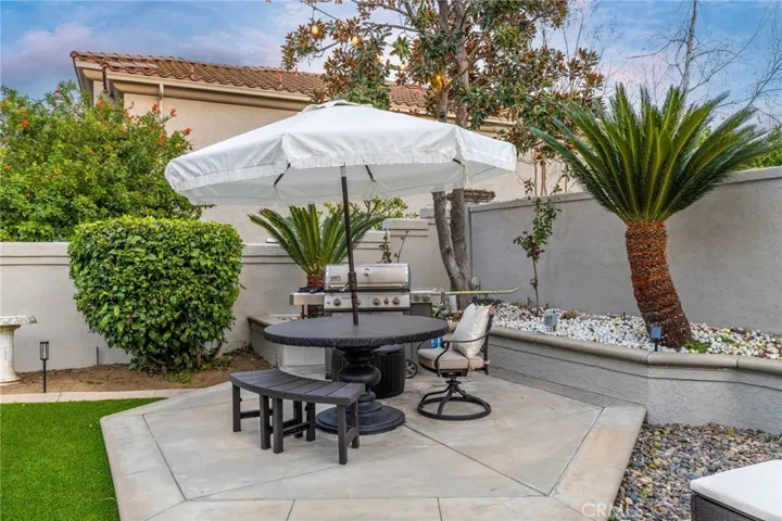 Backyard corner with concrete decking.