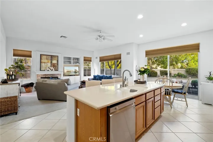 Kitchen looking towards the sliding door that accesses the backyard.