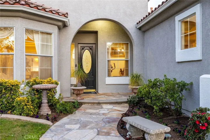 Stone pathway leading to the covered front porch.