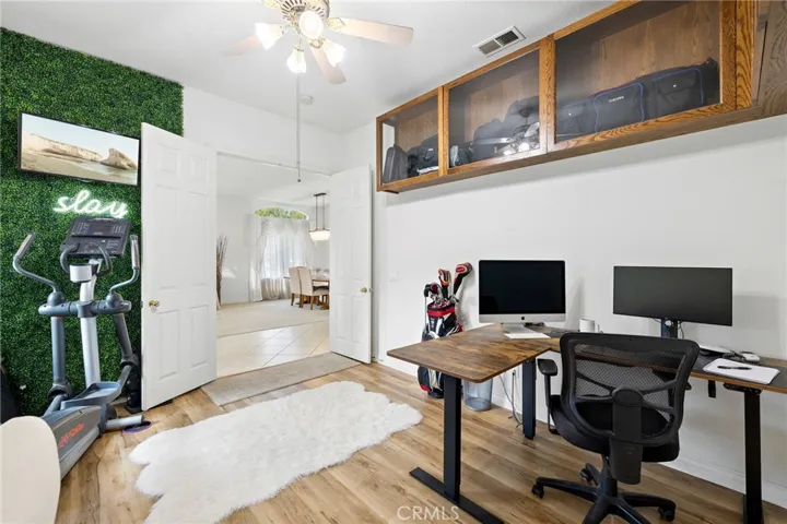 Office with double entry doors just off the front entryway.