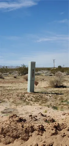 Cable line box at the corner of Jupiter and Outpost. Per Google Earth, this point is about 650 feet north of the subject property. Marked with number 1734.