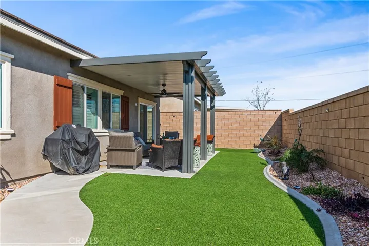 Backyard with covered patio 1 fans with light