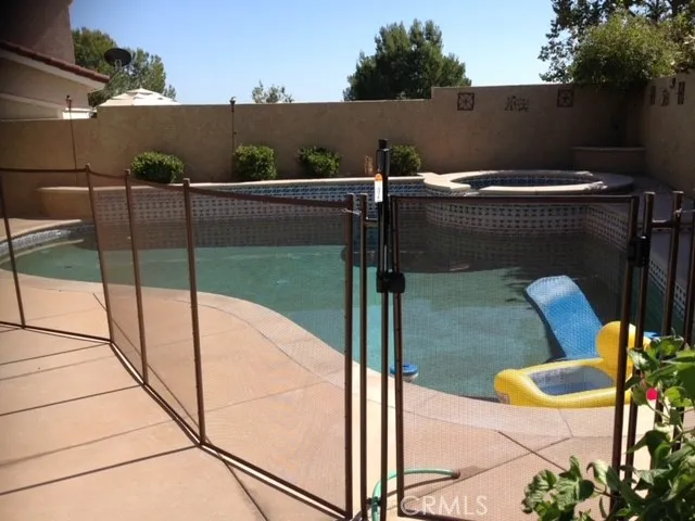Pool fence goes with property