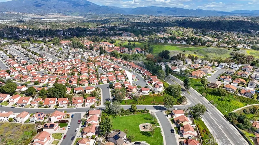 Saddleback Mountains in the distance, development is surrounded by greenbelts.